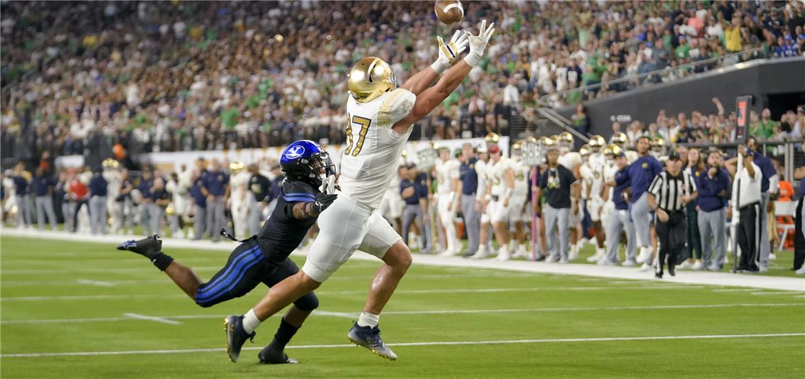 Notre Dame Fighting Irish tight end Michael Mayer (87) catches a pass against Brigham Young Cougars wide receiver Keanu Hill (1) during the second half at Allegiant Stadium.  Lucas Peltier-USA TODAY Sports

                    