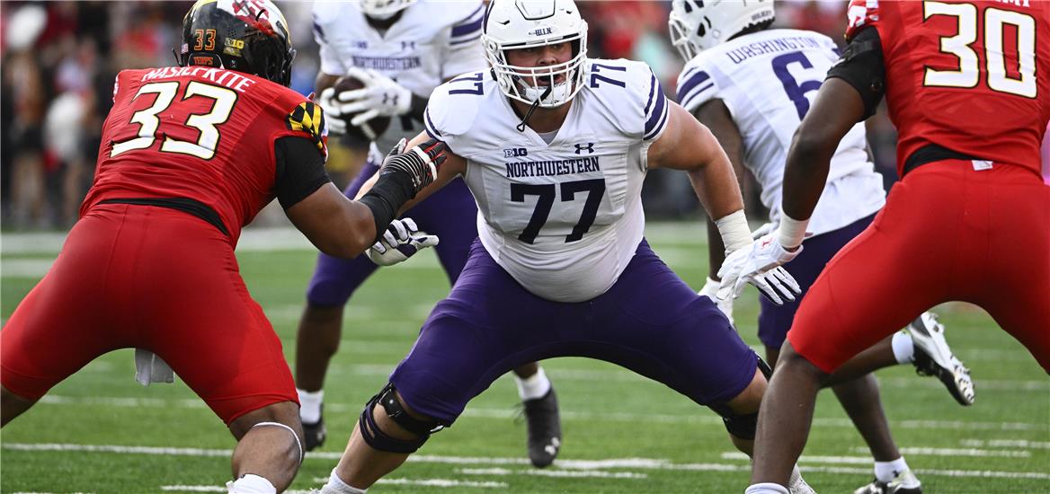 Northwestern Wildcats offensive lineman Peter Skoronski (77) prepares to block against the Maryland Terrapins at SECU Stadium.: Brad Mills-USA TODAY Sports