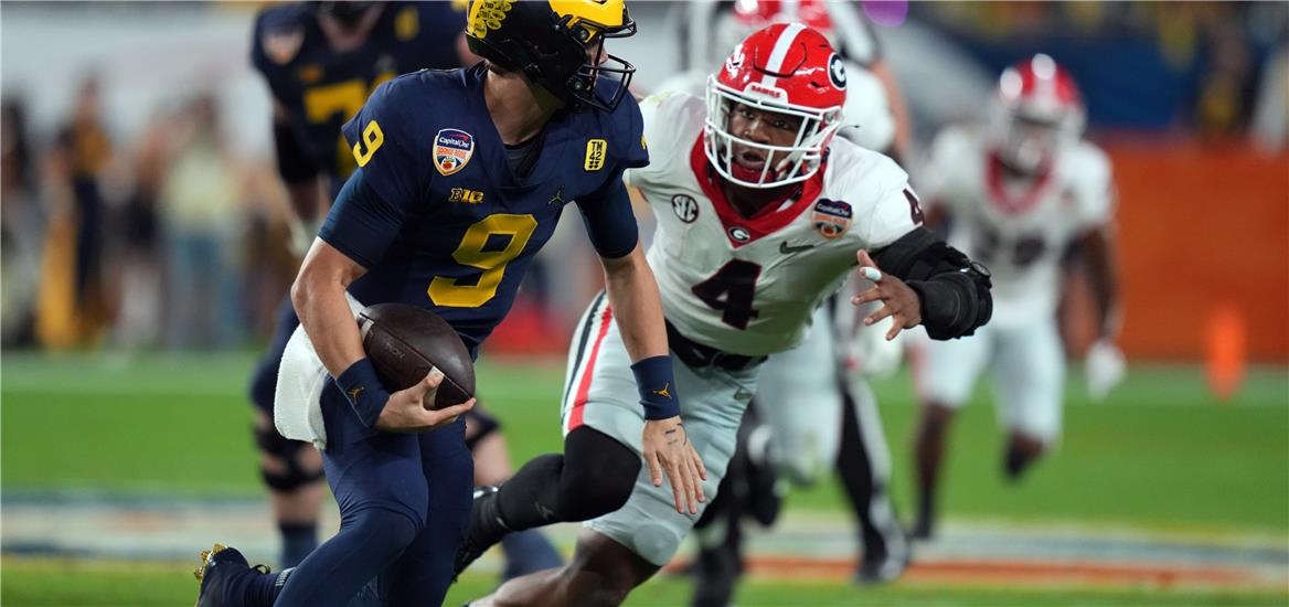 Michigan Wolverines quarterback J.J. McCarthy (9) scrambles against Georgia Bulldogs linebacker Nolan Smith (4) during the second quarter in the Orange Bowl college football CFP national semifinal game at Hard Rock Stadium. Jasen Vinlove-USA TODAY Sports