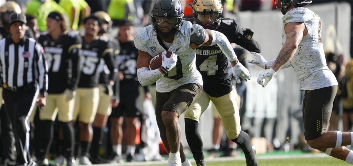 Oregon Ducks defensive back Christian Gonzalez (0) returns an interception in the third quarter against the Colorado Buffaloes at Folsom Field.  Ron Chenoy-USA TODAY Sports