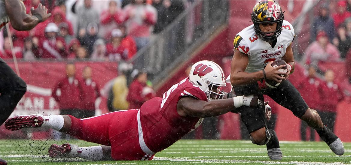 Nov 5, 2022; Madison, Wisconsin, USA; Wisconsin Badgers nose tackle Keeanu Benton (95) sacks Maryland Terrapins quarterback Taulia Tagovailoa (3) during the first quarter at Camp Randall Stadium. Mark Hoffman/Milwaukee Journal Sentinel via USA TODAY NETWORK