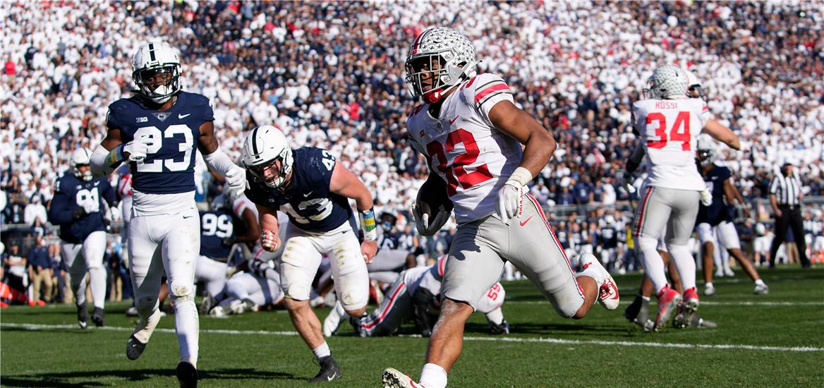 Ohio State Buckeyes running back TreVeyon Henderson (32) runs for a 7-yard touchdown past Penn State Nittany Lions linebacker Tyler Elsdon (43) and linebacker Curtis Jacobs (23) during the fourth quarter of the NCAA Division I football game at Beaver Stadium. Adam Cairns-The Columbus Dispatch Ncaa Football Ohio State Buckeyes At Penn State Nittany Lions