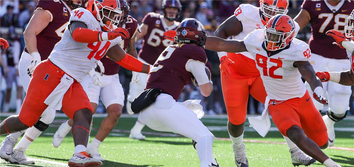 Minnesota Golden Gophers quarterback Tanner Morgan (2) is brought down by Illinois Fighting Illini defensive lineman Jer'Zhan Newton (94) and linebacker Isaiah Gay (92) for a loss in the fourth quarter at Huntington Bank Stadium. Matt Krohn-USA TODAY Sports

                    